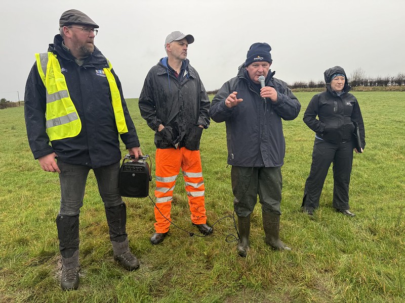 Noel Feeney speaks to crowd with Microphone