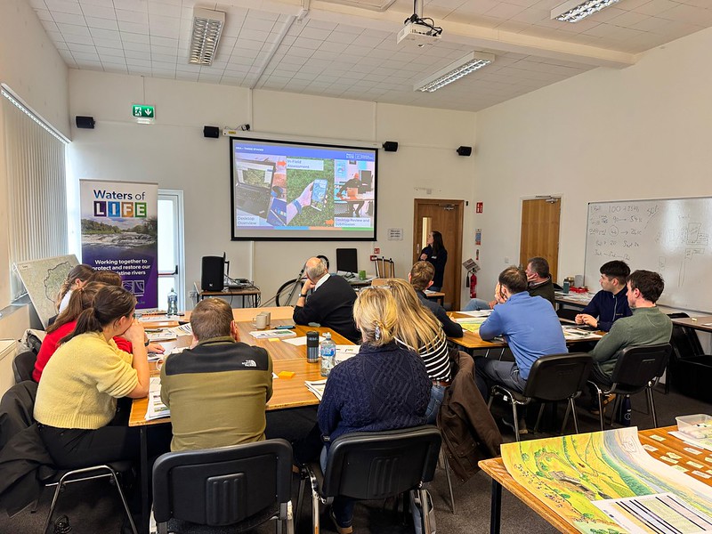 Image of Advisors attending water quality training in a classroom for Waters of LIFE